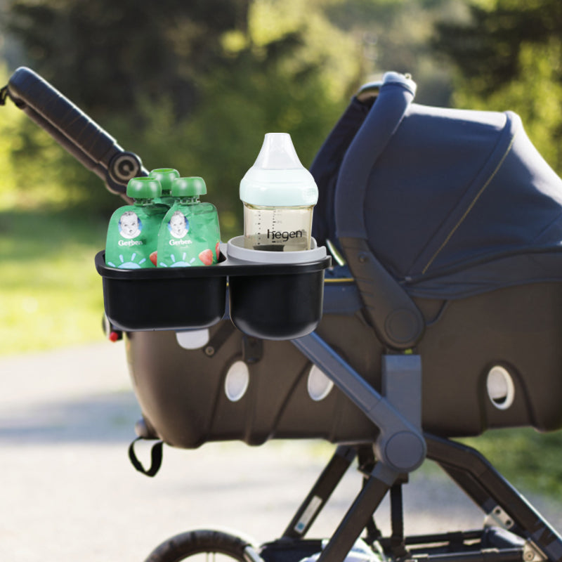 LUFFCABO stroller cup holder attached to a stroller, ideal for holding bottles and baby essentials