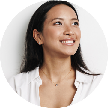 A mom wearing a necklace with a diamond