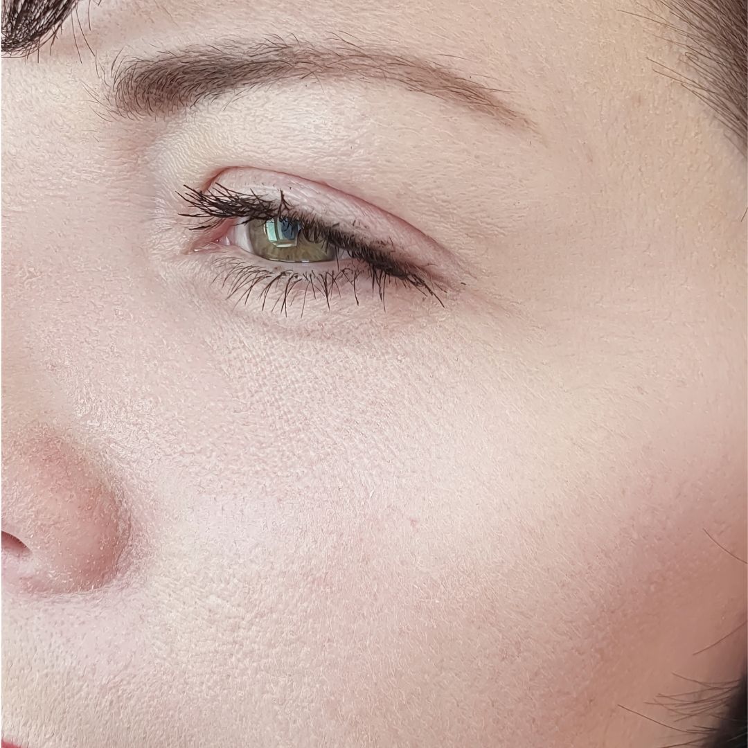 Close-up of a person's eye without wrinkles on the skin