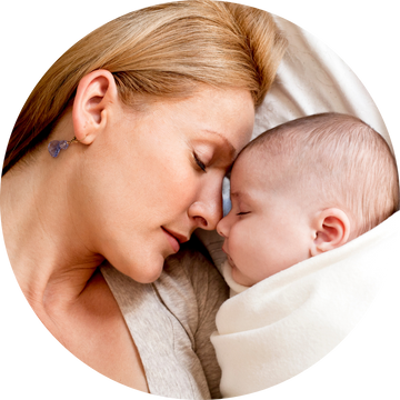 Woman and baby embracing closely