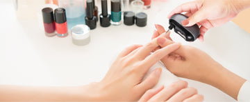 Professional electric nail file effortlessly polishing an adult’s nails to a smooth, high-shine finish at home