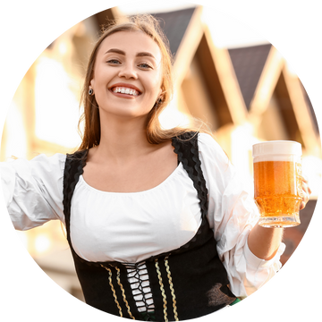A mom in traditional Bavarian outfit holding a beer mug