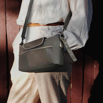 Person wearing a black shoulder bag