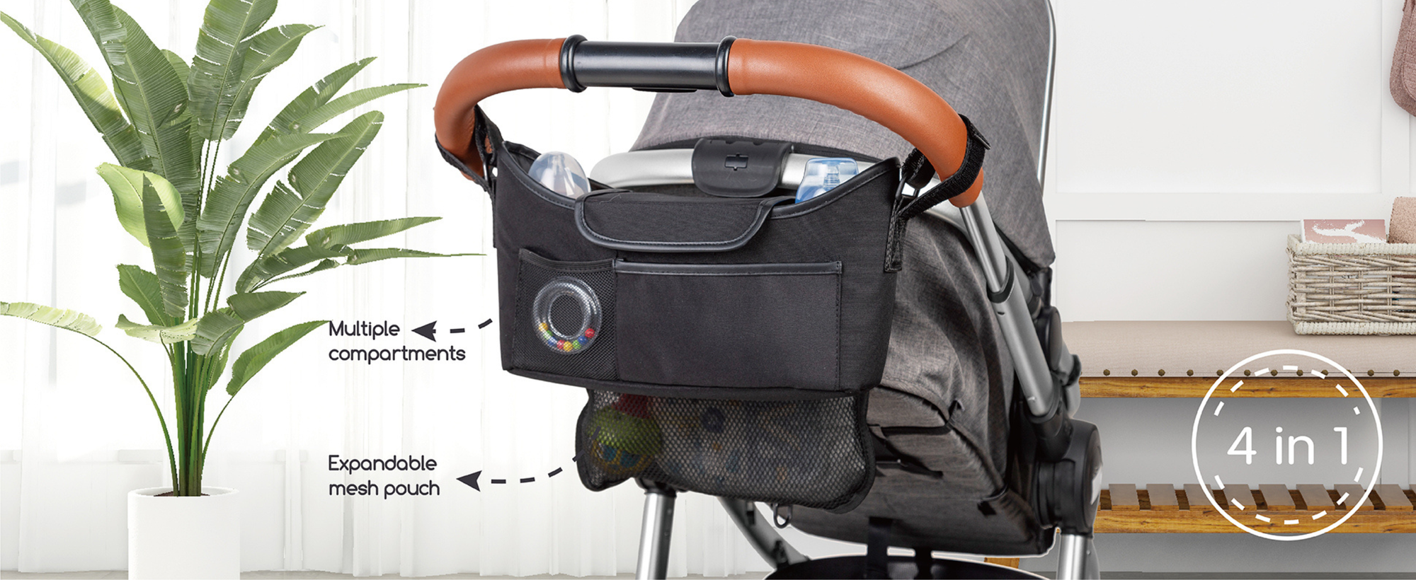 Stroller organizer with multiple compartments attached to a stroller, featuring expandable mesh pouch