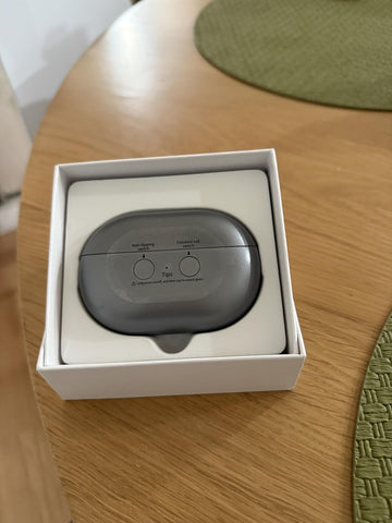 Gray electronic nail clipper  in a white box 