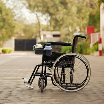 Wheelchair cup holder on a wooden deck 