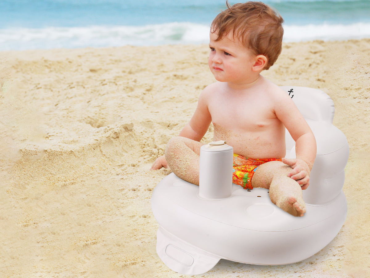 LUFFCABO inflatable baby seat, ideal for beach outings, providing support as a baby travel essentials