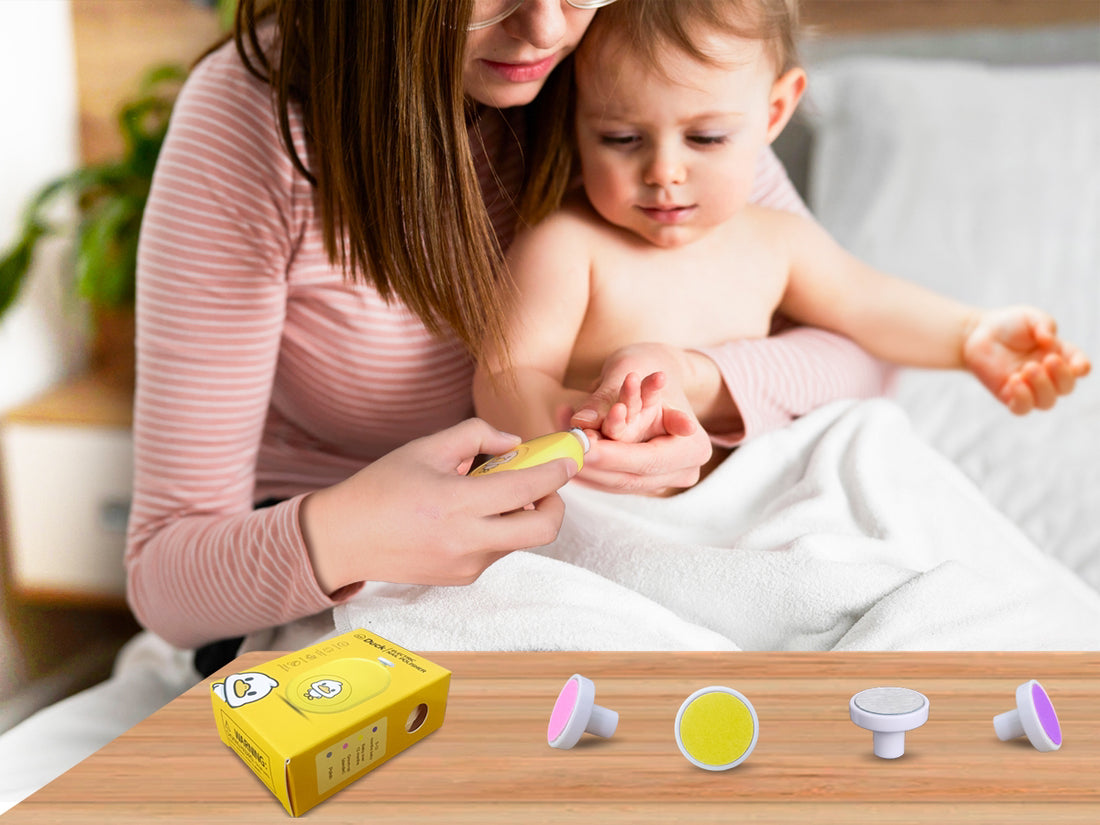 Yellow electric polisher with cartoon duck design, packaging, and additional attachments