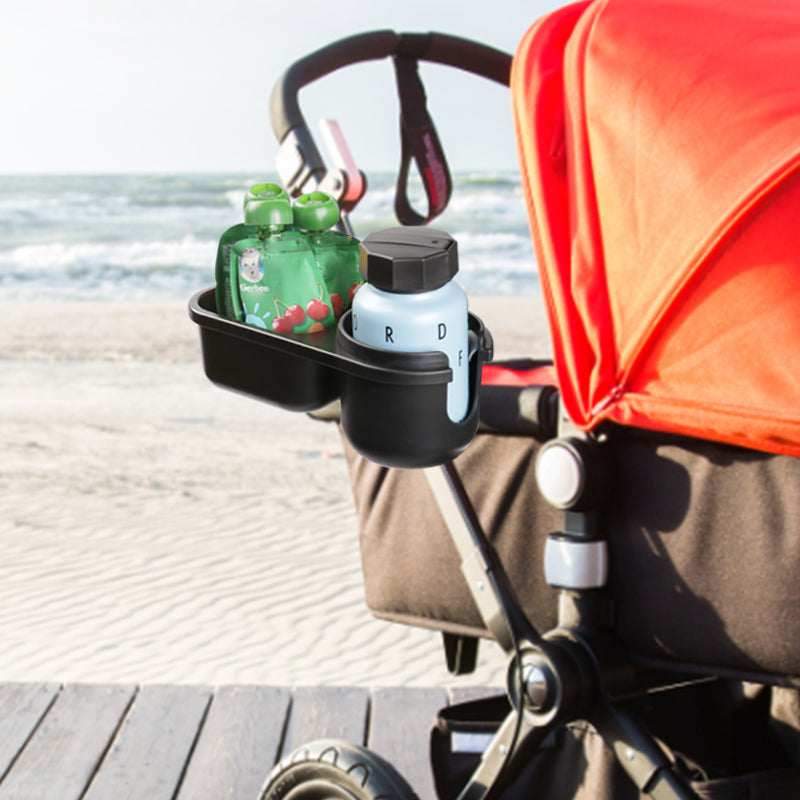 LUFFCABO stroller cup holder on stroller by the beach, ideal for bottles and baby travel essentials