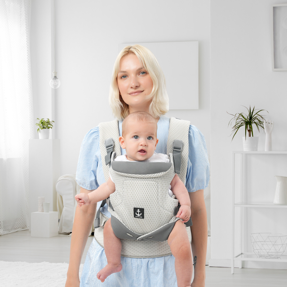 The LUFFCABO Mesh Baby Carrier provides cool and comfortable support - A woman holding her baby securely in a bright, sunlit room