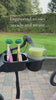 Snack tray securely attached to a stroller and ready for use, holding juice for convenient